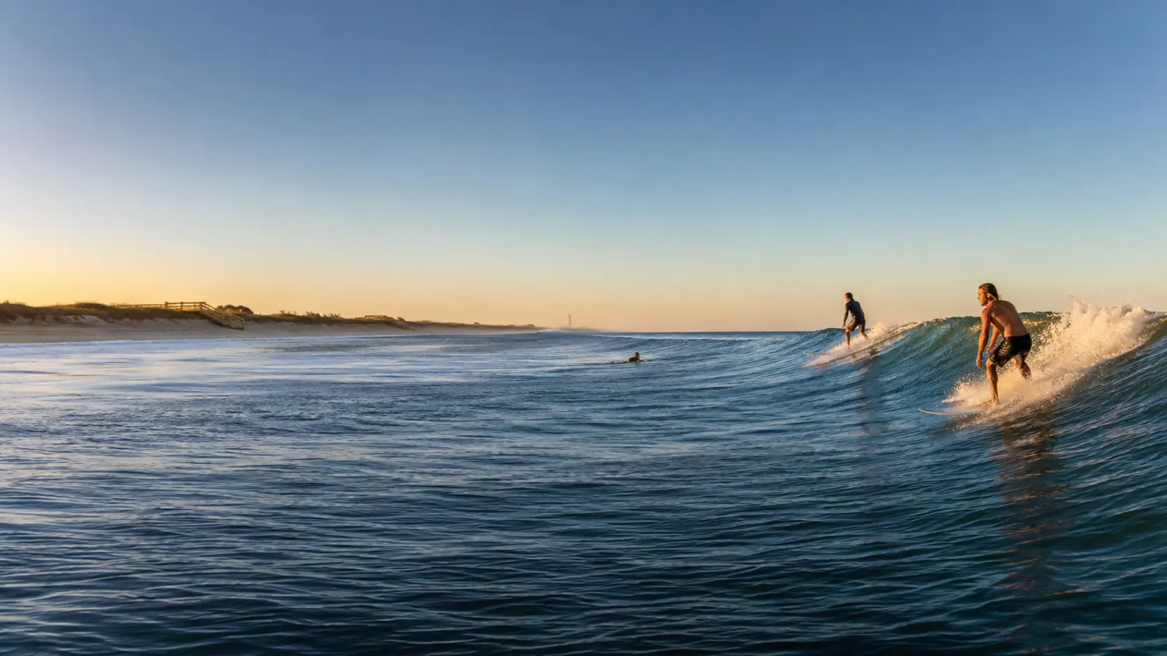 Surfers riding clean morning waves off Florida’s Space Coast