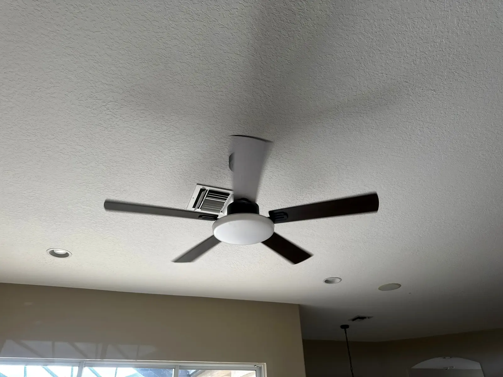 Modern black-and-white ceiling fan with integrated light