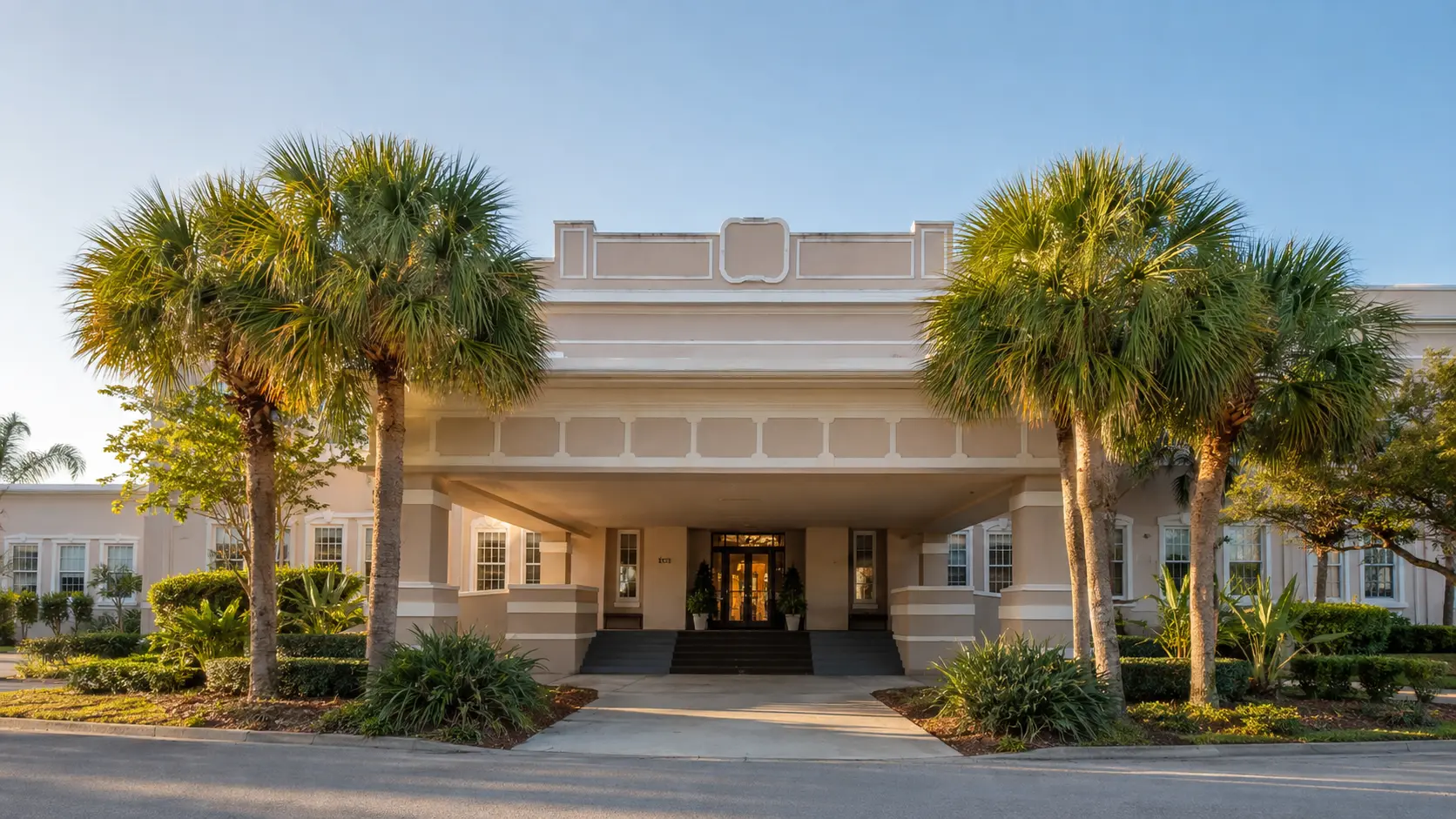 The historic Henegar Center entrance framed by palm trees in Downtown Melbourne